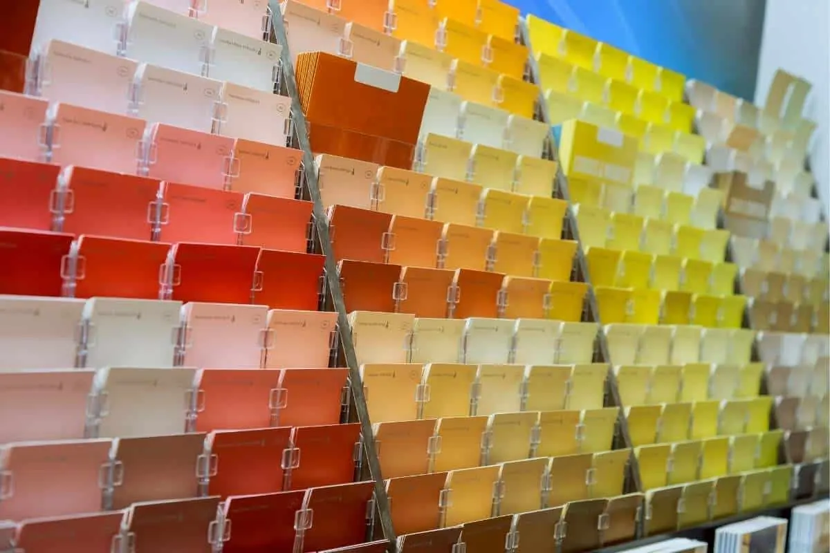 Exterior paint color swatches fanned out against a home exterior