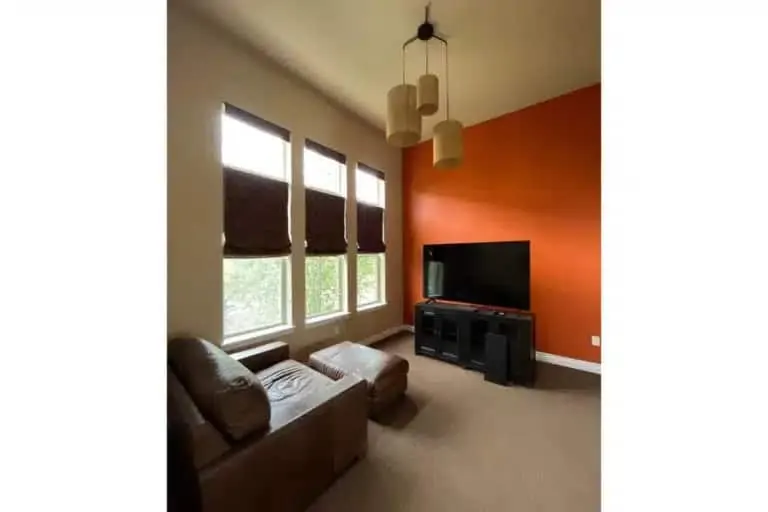 An interior with accent colors picked up from artwork and furnishings