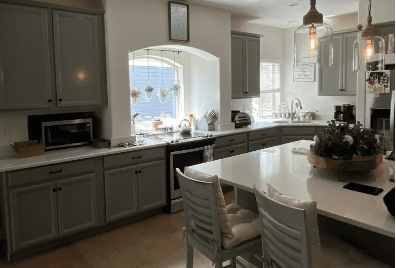 Kitchen cabinets painted in the deep green Shade Grown
