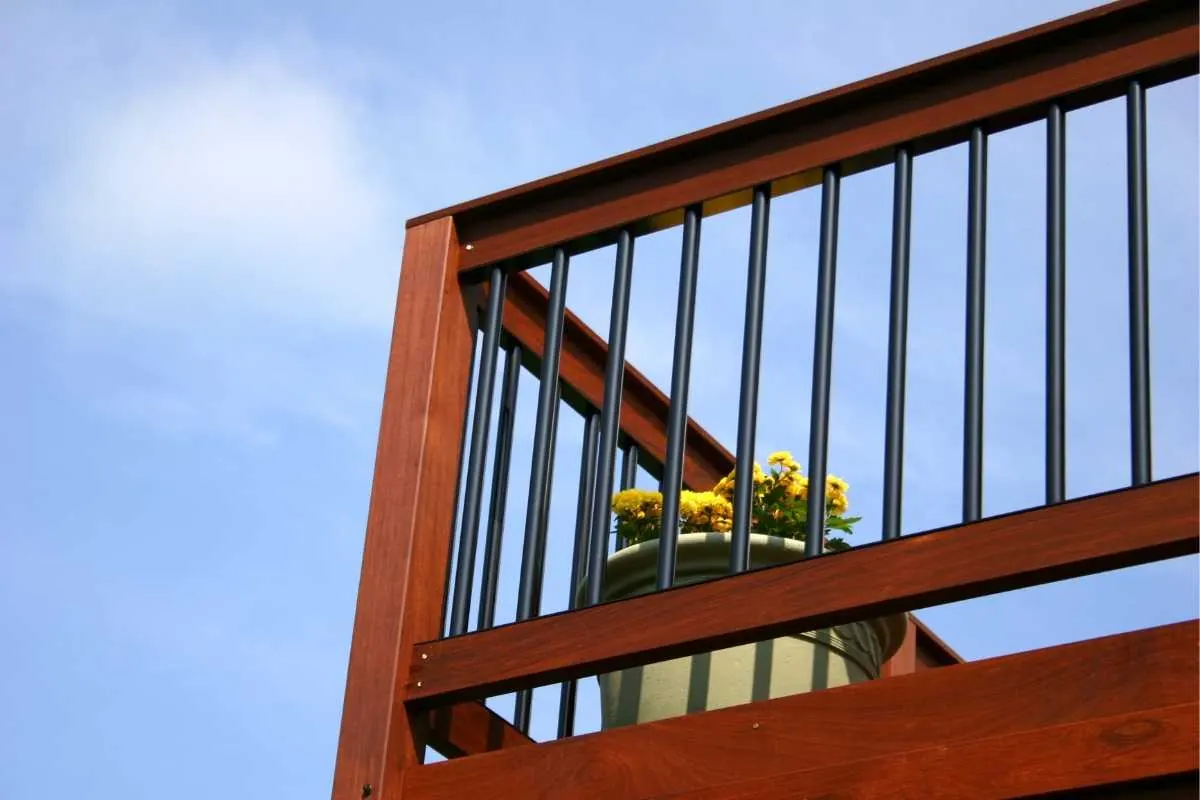 Looking up at the underside corner of a wooden deck