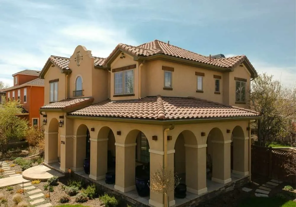Aerial view of a tan painted stucco home