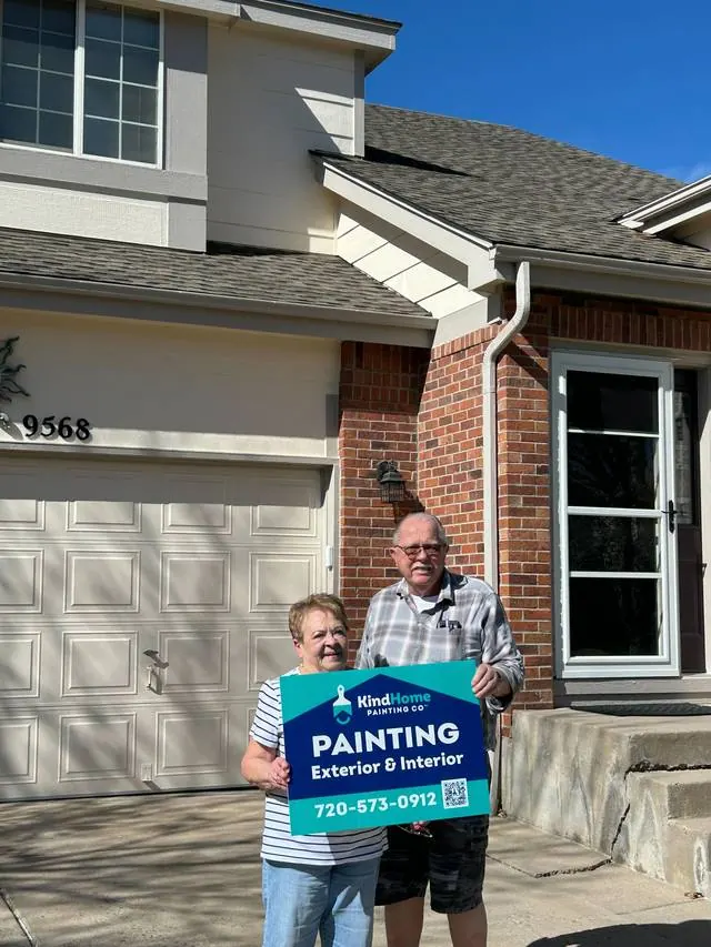 Margaret Wright in front of her newly painted home